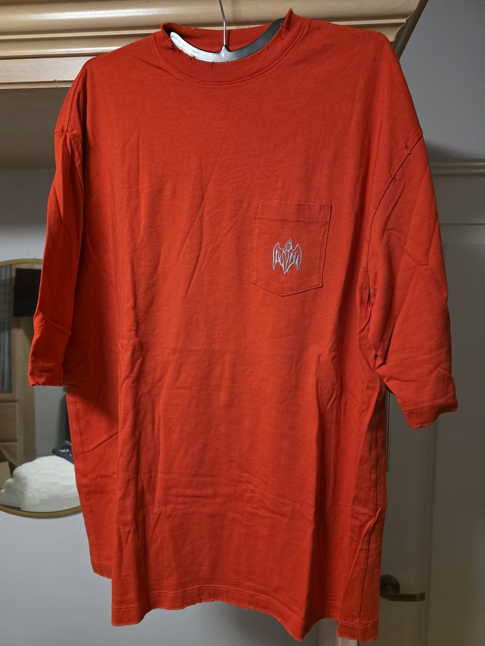 Warren Lotus Men's Red-Orange Short-Sleeve Pocket Tee with Subtle Chest Motif